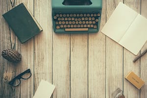 Translations on typewriter with paper and glasses